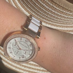 Gold and white Michael Kors women’s watch